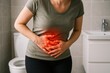 © Boke - Woman suffering from strong stomach ache in bathroom