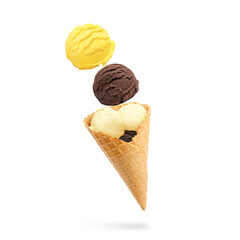 Wall Mural - ice cream scoops and waffle cone in air on white background