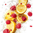 © Png Vibex - Raspberries and Lemon Slices Falling Into Water Isolated on Transparent Background