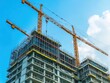 © ktianngoen0128 - Highrise construction project with cranes and scaffolding in urban environment aerial view for industry insights