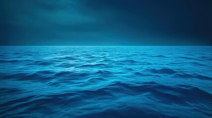 Wall Mural - A dark blue ocean with a few waves
