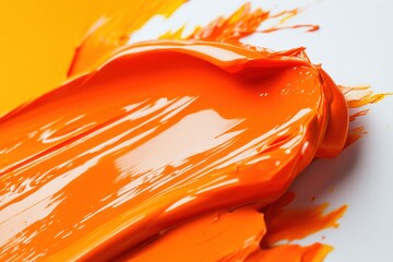 Poster - Vibrant orange paint splashes creating dynamic textures on a clean surface in a creative studio setting during the day