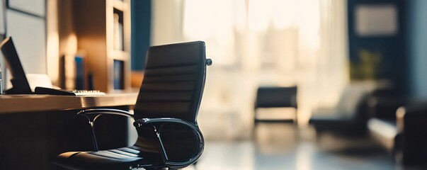 Fototapete - Empty office chair sitting in front of desk at sunset