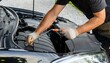 © 솔이 최 - A mechanic working with tools on the car bonnet