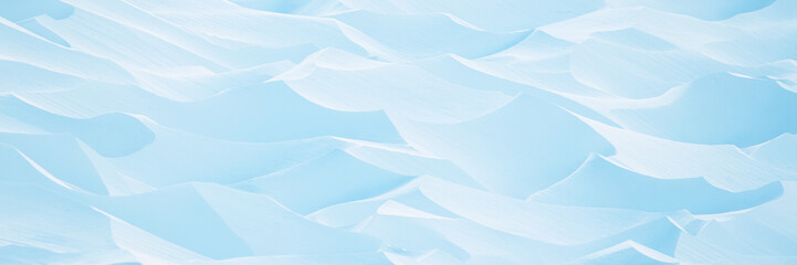 Wall Mural - snow texture. wind sculpted patterns on snow surface. wind in the tundra and in the mountains on the