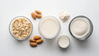 © siraphol - Oats, almonds, milk, and flour arranged in bowls create wholesome scene