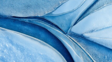 Aufkleber - This close-up top-down view reveals an abstract ice texture bathed in soft blue light, highlighting the delicate natural patterns found in frozen surfaces