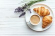© Chatchanan - A flat lay composition of a simple breakfast, crispy croissants,