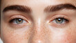 © Keopaserth - Close up of woman face showcasing natural beauty with freckles, clear skin, and expressive eyes. image captures essence of authenticity and individuality
