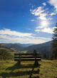 © A.Freund - old, partially weathered wooden bench on a mountain meadow in the Black Forest taken with sunbeams against the sun