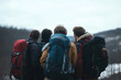 © Татьяна Евдокимова - Four male hikers with backpacks are enjoying the view of a mountain landscape during a winter hike