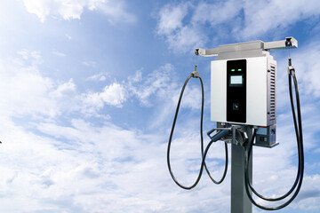 Aufkleber - Electric vehicle charging station on the background of blue sky