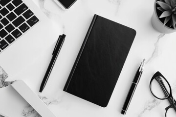 Poster - Neatly arranged monochrome office essentials including a notebook, pen, mobile phone, and other accessories on a sleek surface for a stylish workspace
