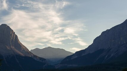 Wall Mural - sky and mountain timelapse. a cloudy morning atmosphere in the summer season. natural landscape back