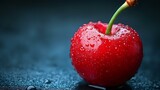 Fresh ripe red cherry with water drops on dark background, macro shot showing details of fruit texture and natural moisture on glossy surface.