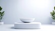 © bambang - A minimalist image shows a white bowl atop a square platform. Two small potted plants flank the structure, creating symmetry. The scene is brightly lit, high-resolution, and features a clean, modern