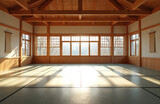 Empty dojo with wooden construction, tatami mats. Sunlight through windows. Martial arts training studio, space for judo, karate, taekwondo, aikido. Place for meditation, self-improvement. Dojo for