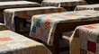 © ARDIA - Vintage Patchwork Quilts Drapped Over Carved Wooden Benches in Sunlight