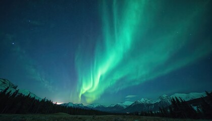 Wall Mural - Stunning aurora borealis lights up night sky over mountains. Green and blue colors illuminate dark landscape. Wonderful natural phenomenon, night scenery, space exploration, travel adventure.
