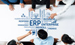 © InfiniteFlow - A dynamic team collaborates around a table, focusing on ERP strategies to enhance business operations, showcasing teamwork in planning, finance, and resource management. Amity