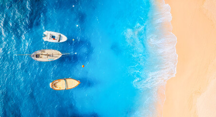 Wall Mural - drone view of a boats. marine transport. beach and waves. vacation and holidays. aerial landscape. s