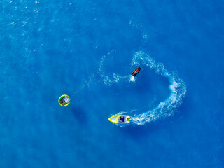 Wall Mural - vacation and leisure. aerial view on fast boat on blue sea at sunny day. fast ship on the sea surfac