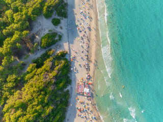 Wall Mural - aerial view on beach, people and umbrellas. vacation and adventure. europe, mediterranean sea. top v