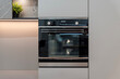 © Sergey - Oven with glass door, metal handle and digital control knobs