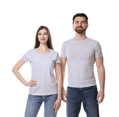 Wall Mural - woman and man wearing blank t-shirts on white background. mockup for design
