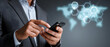 © John - Businessman using a mobile device to interact with global healthcare technologies and digital health innovations