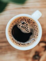 Aufkleber - Top-down view of a white ceramic coffee cup filled with rich black espresso on a soft neutral background in a minimalist setting