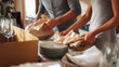 © Nakarin - Couple packing dishes with care for house move, surrounded by boxes and glassware