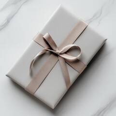 Poster - Elegant Gift: Gray Wrapped Present with Textured Ribbon on Marble Background, Minimalist Design for Special Occasions 