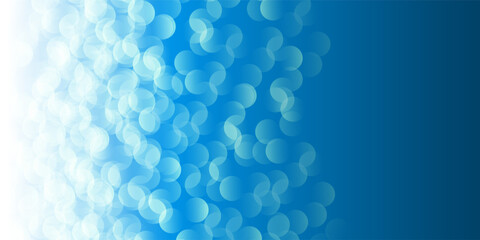 Wall Mural - a soft blue bokeh pattern background creates a dreamy, ethereal atmosphere. the blurred circles of l