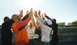 © Jacob Lund - Diverse group of runners celebrate with a joyful high five