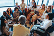 © Jacob Lund - Diverse college group in engaging discussion with instructor, fostering inclusion and learning in a collaborative setting