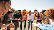 © Jacob Lund - Group of friends cheering and clapping at marathon event