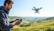 © ЮРИЙ ПОЗДНИКОВ - Videographer flying drone over green hills landscape