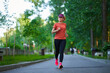© Xalanx - Woman jogging in summer park.........