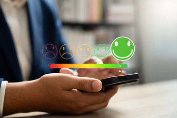 Wall Mural - digital satisfaction survey, smiley face, customer using smartphone to rate services with 5 star smi
