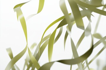Leinwandbilder - Swirling green ribbons create an abstract composition against a soft white background in a dynamic display of movement