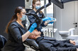 © puhimec - A team of dentists treats a patient's teeth using modern equipment. Dentistry concept.