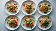 ©  AugmentArt - Traditional Italian linguini pasta featuring tomatoes and basil is displayed against a white background. A collection of pasta with tomatoes from various angles.