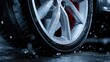 © Giman - Close-up of a car wheel after rain. Water droplets cling to the alloy rim
