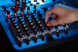 © New Africa - Woman working with professional mixing console at table, closeup