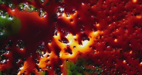 Wall Mural - mesmerizing blending and mixing of alcohol inks creates abstract art filled with vibrant green orang