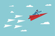 © Sector30 - Leadership to guide team direction lead to success, determination or decision to motivate team, power to control or influence people concept, confident businessman lead other paper airplane origami.