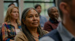 © Postmodern Studio - Mature hispanic woman attending educational seminar with diverse group