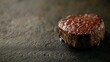 © MOPP - A perfectly seared steak resting on a textured surface, showcasing its juicy, appetizing appearance with rich color and slight sheen.