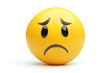 © SS Stock - A sad yellow emoji with a frown against a white isolated background, conveying feelings of disappointment and sadness.